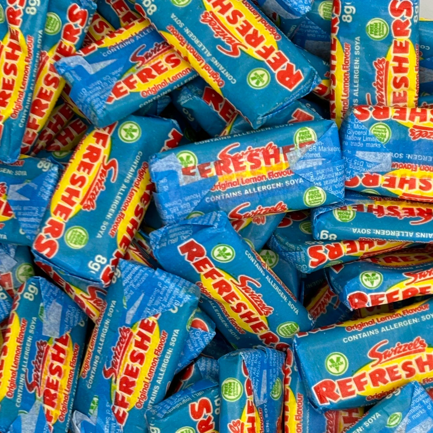 Swizzels Refreshers - Lemon flavour chewy sweets with a sherbet centre.