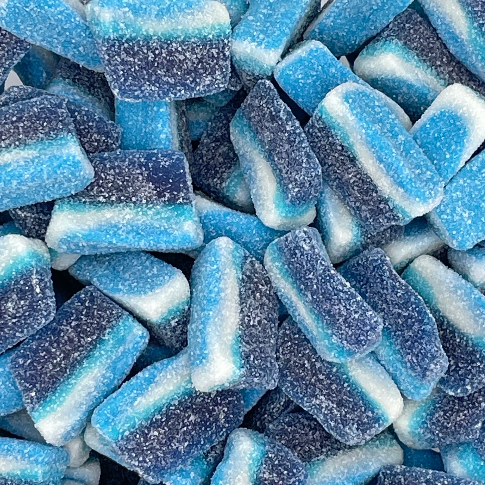 Blue Raspberry Slices - Bright blue coloured jelly sweets with blue raspberry flavour and sugar coating.