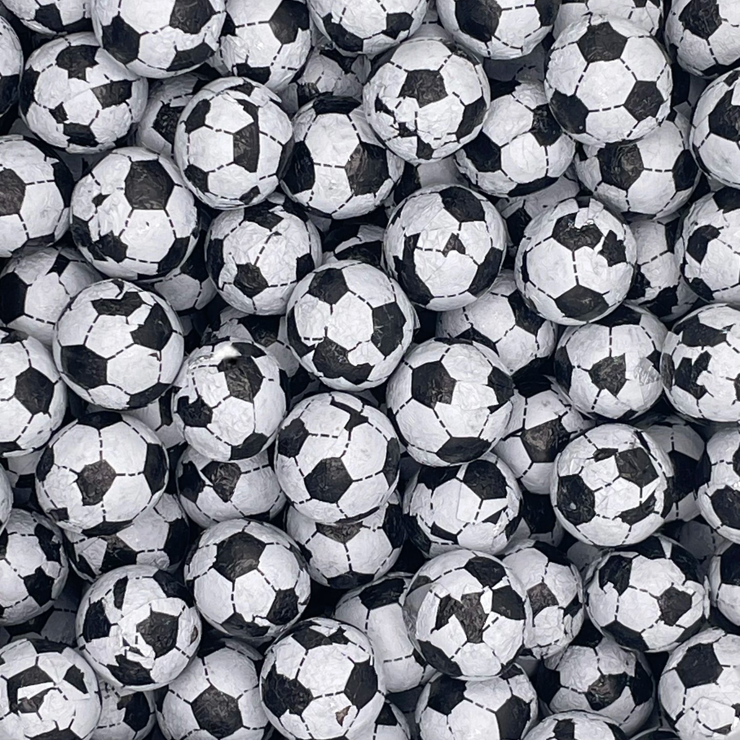 Black and white foil wrapped chocolate footballs