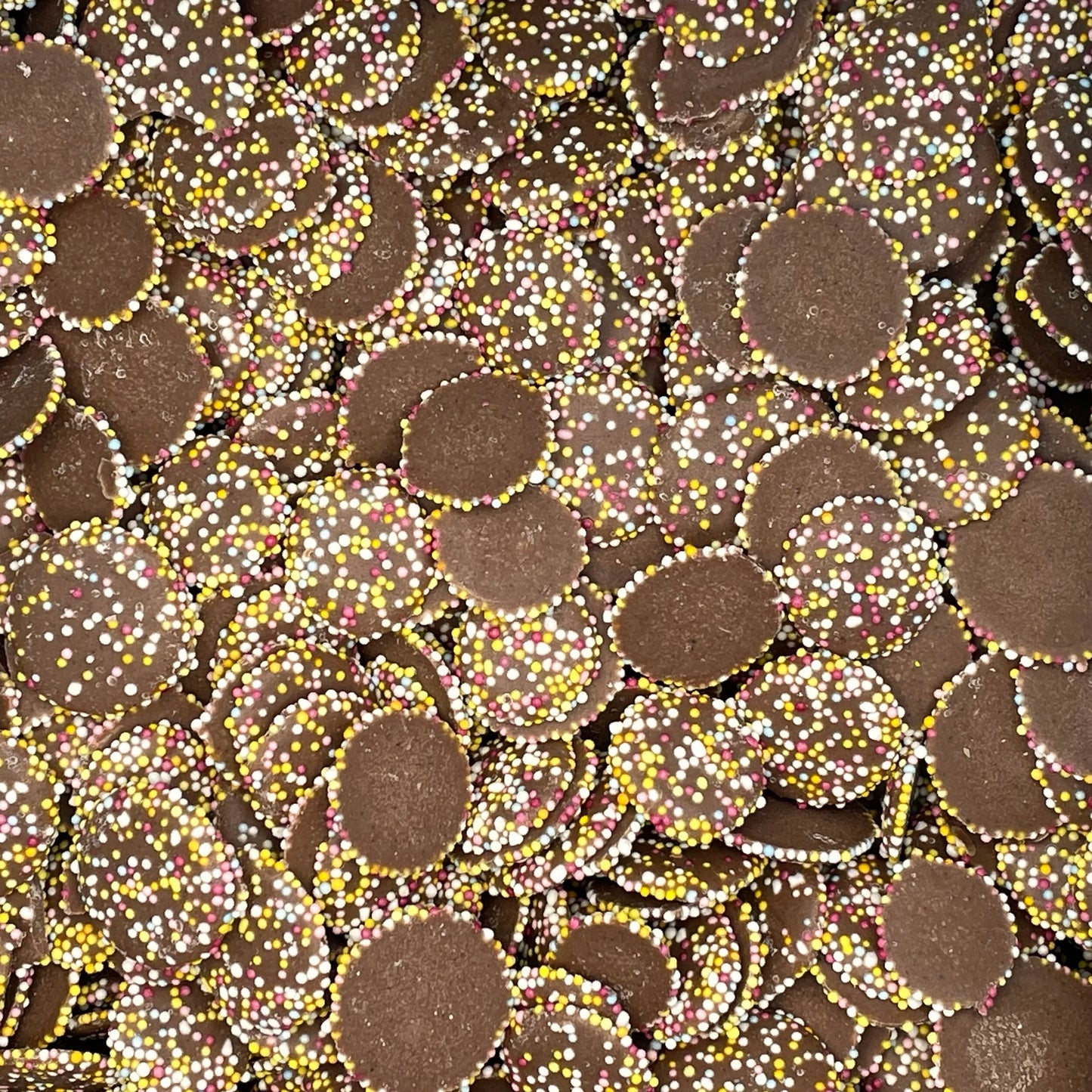 Jazzies, chocolate flavour candy rounds with a hundreds and thousands topping.