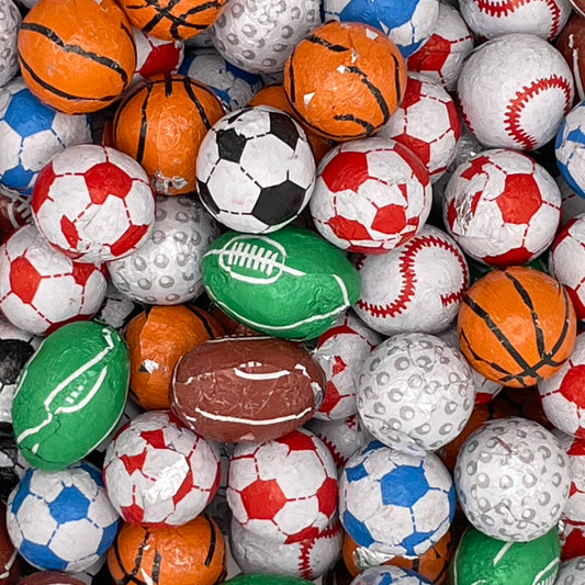 Kinnerton Chocolate Flavour Sports Balls - Chocolate flavoured balls in coloured foils, Made to look like a variety of sports balls.