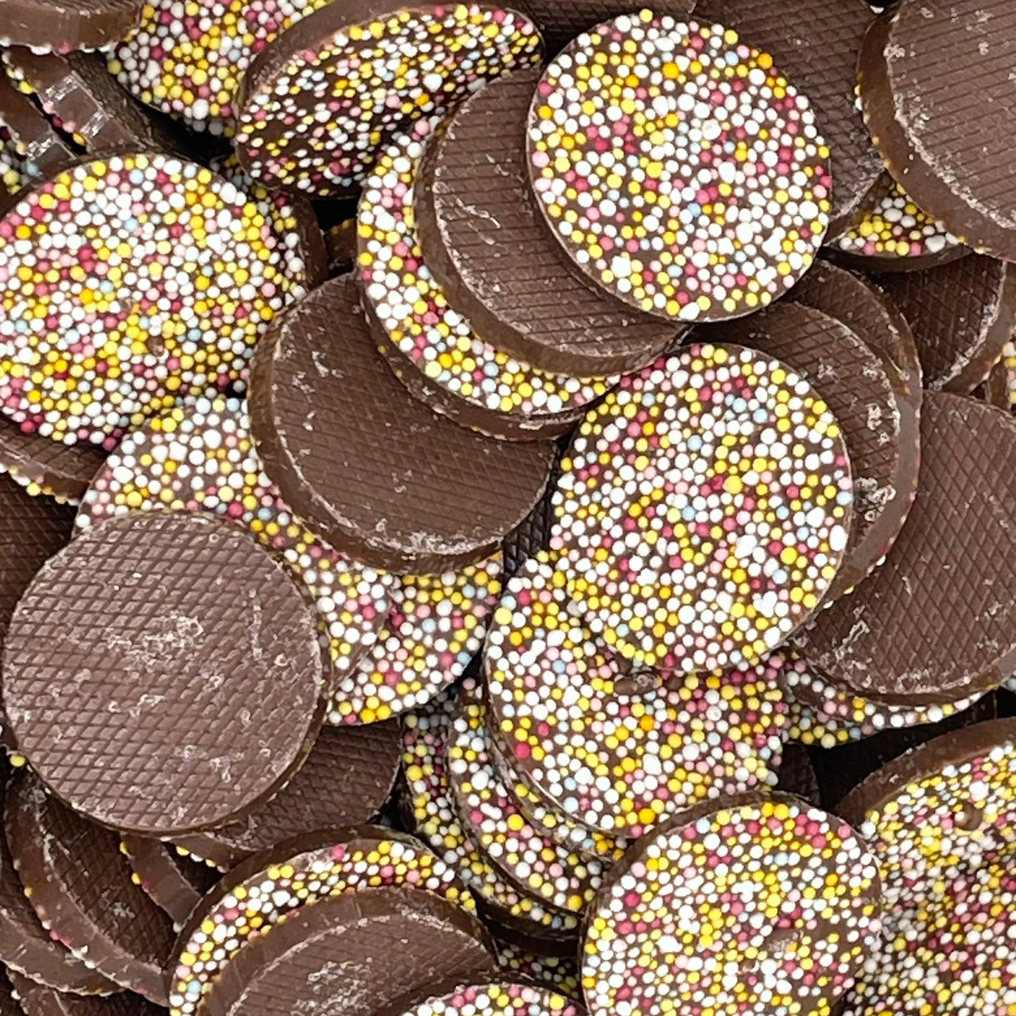 Mega Jazzles - Oversized chocolate flavour discs topped with tiny candy pieces.