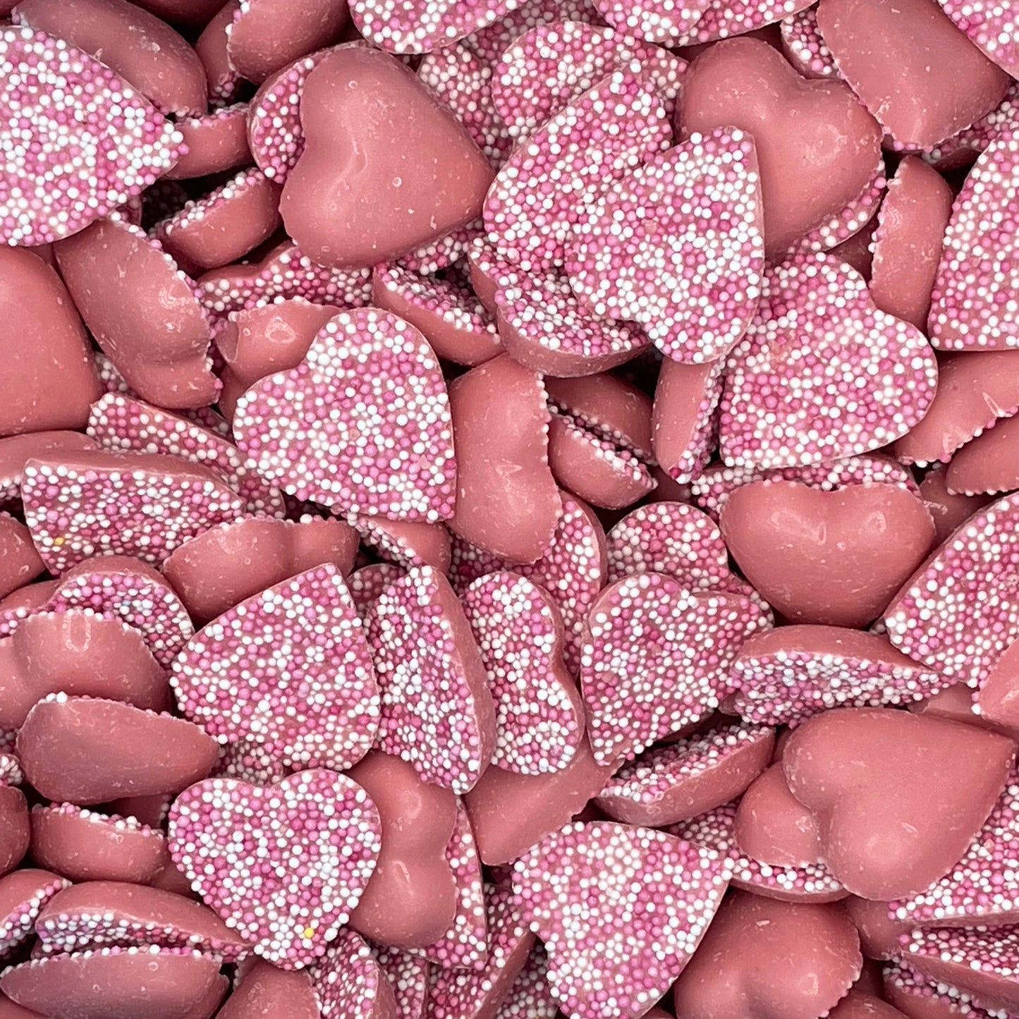 Pink Herats. Strawberry flavour candy pieces topped hundreds and thousands.