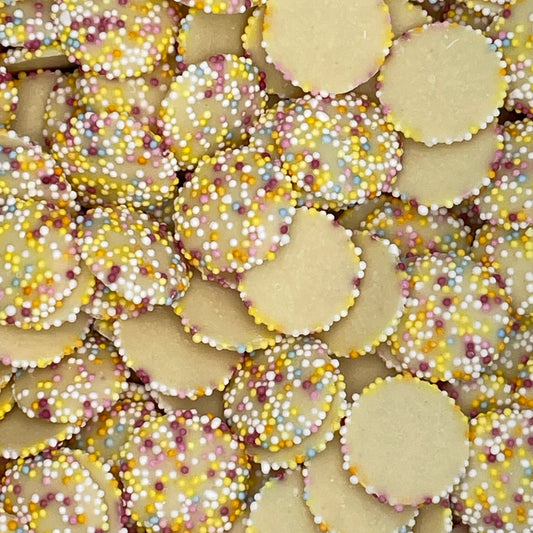 White Snowies - white chocolate flavour discs  covered in colourful candy pieces